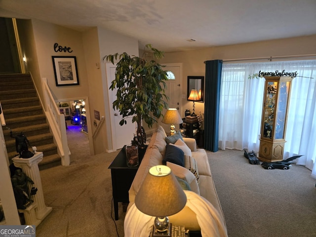 6193 Charring Cross Ct, Lithonia, GA 30058 - carpeted living room with stairs and healthy amount of natural light