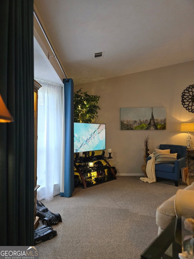 6193 Charring Cross Ct, Lithonia, GA 30058 - living area with carpet flooring and baseboards
