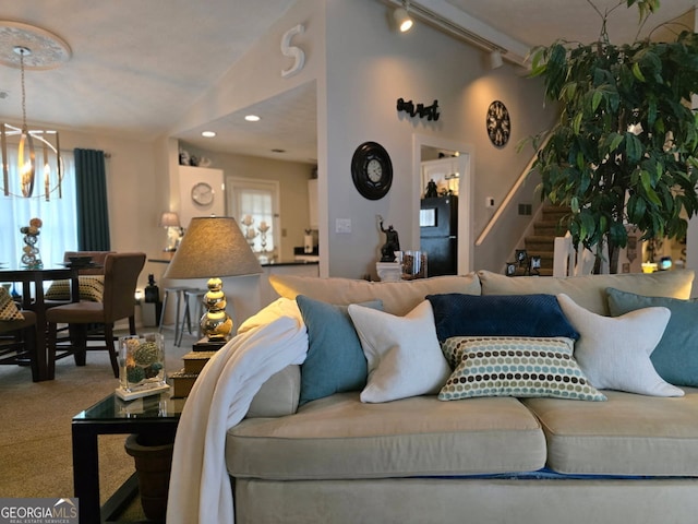 6193 Charring Cross Ct, Lithonia, GA 30058 - carpeted living area with a chandelier, stairs, track lighting, and recessed lighting
