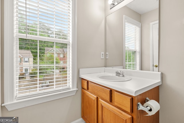 bathroom featuring vanity and baseboards