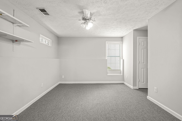 unfurnished room featuring a healthy amount of sunlight, ceiling fan, and carpet floors