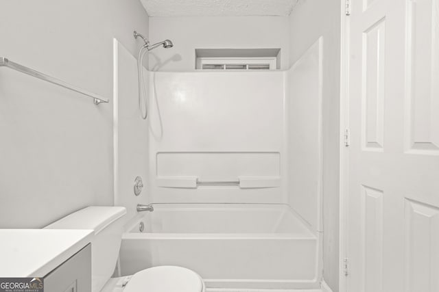 full bathroom with toilet, vanity, shower / bathtub combination, and a textured ceiling