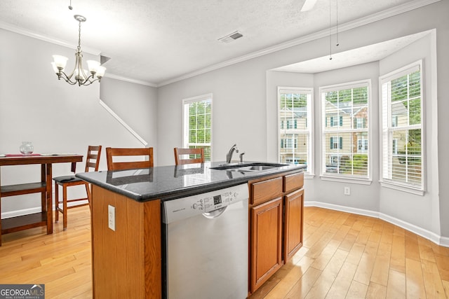 kitchen with visible vents, stainless steel dishwasher, light wood-style flooring, and a sink