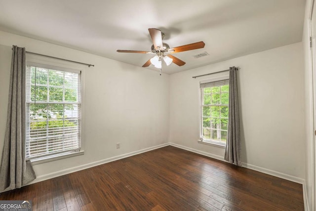 4240 Cascade Rd SW, Atlanta, GA 30331 - empty room with baseboards, a ceiling fan, hardwood / wood-style flooring, and a healthy amount of sunlight