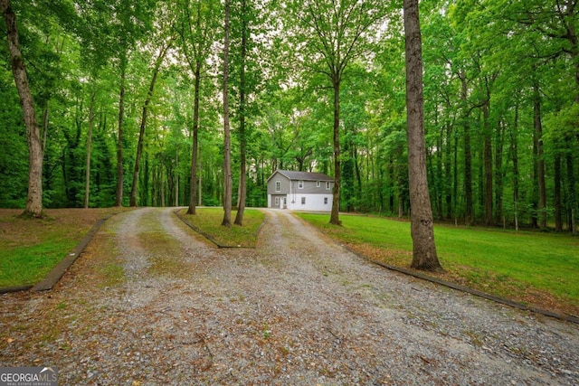 4240 Cascade Rd SW, Atlanta, GA 30331 - view of front of house featuring a front yard, a wooded view, and gravel driveway