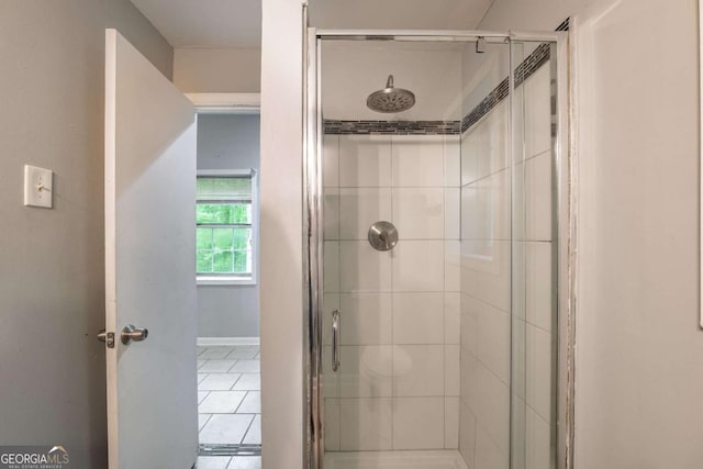 4240 Cascade Rd SW, Atlanta, GA 30331 - bathroom featuring a stall shower, tile patterned flooring, and baseboards