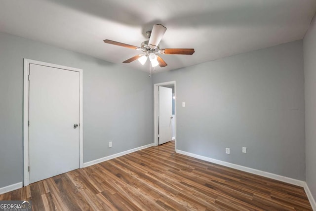 4240 Cascade Rd SW, Atlanta, GA 30331 - unfurnished bedroom featuring wood finished floors, a ceiling fan, and baseboards