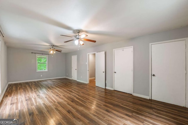 4240 Cascade Rd SW, Atlanta, GA 30331 - unfurnished bedroom featuring wood finished floors, two closets, a ceiling fan, and baseboards