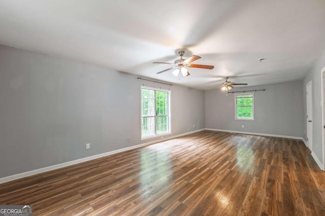 4240 Cascade Rd SW, Atlanta, GA 30331 - spare room with a ceiling fan, dark wood-style flooring, and baseboards