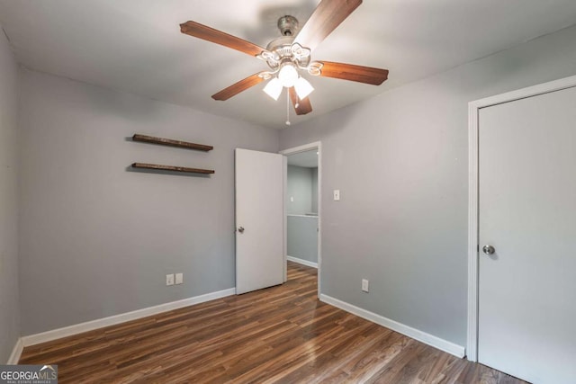 4240 Cascade Rd SW, Atlanta, GA 30331 - unfurnished bedroom featuring baseboards, wood finished floors, a ceiling fan, and a closet