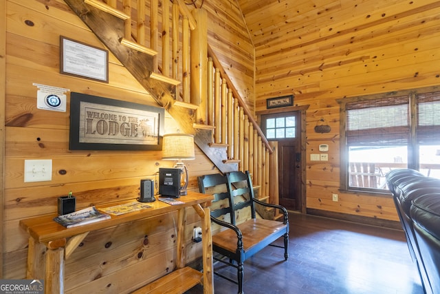 home office featuring wood walls and baseboards