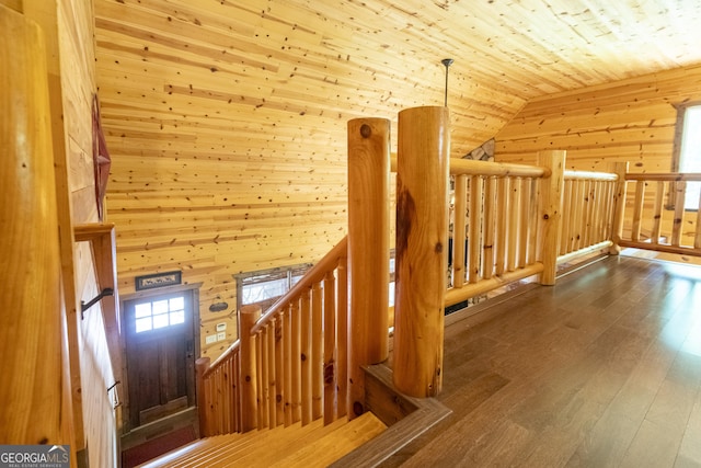 bonus room with wood finished floors, wooden ceiling, wood walls, and lofted ceiling