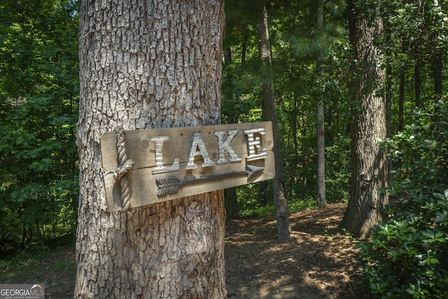 exterior details featuring a wooded view
