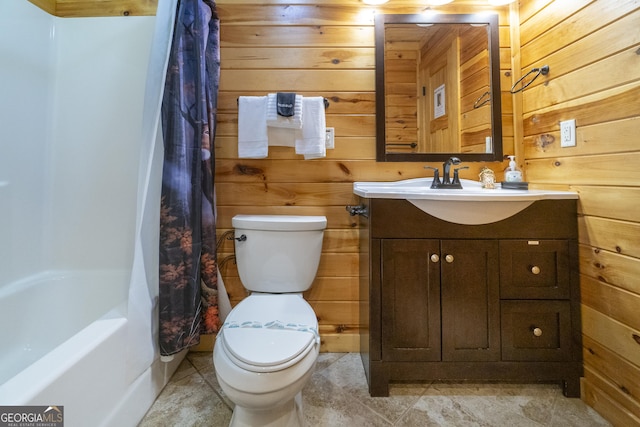 full bath featuring wood walls, vanity, and toilet