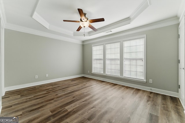 2313 Millhaven St, Smyrna, GA 30080 - spare room with crown molding, visible vents, ceiling fan, a tray ceiling, and dark wood-style floors