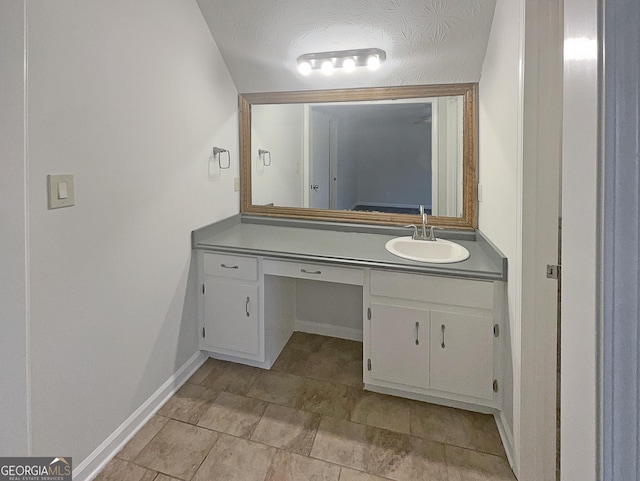 carpeted spare room with baseboards and a ceiling fan