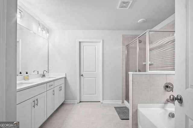 full bath featuring double vanity, visible vents, a sink, and a stall shower