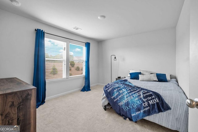 bedroom featuring visible vents, baseboards, and carpet floors