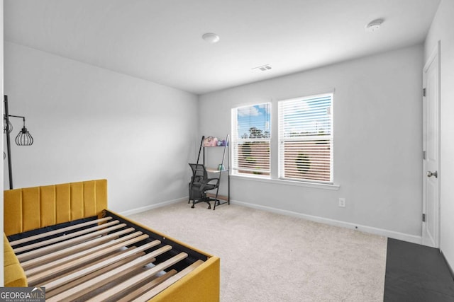 carpeted bedroom with baseboards