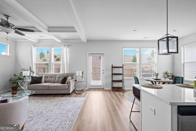 living room with beam ceiling, a ceiling fan, baseboards, recessed lighting, and light wood-type flooring