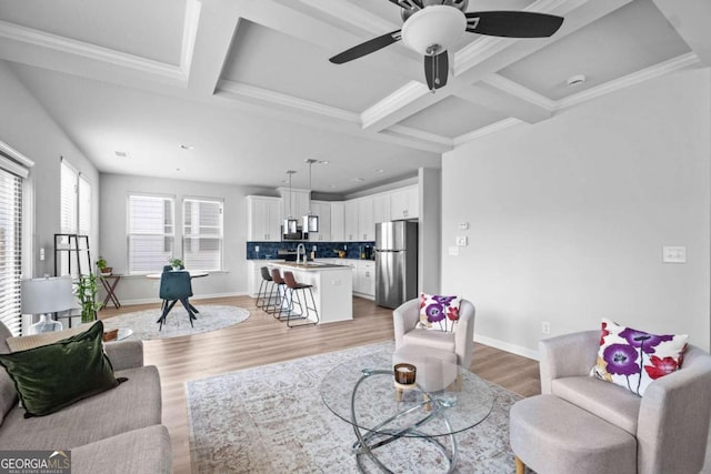 living area with a ceiling fan, beam ceiling, light wood finished floors, coffered ceiling, and recessed lighting