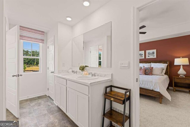 309 Elgin Dr, Lawrenceville, GA 30045 - full bath featuring double vanity, a sink, ensuite bath, and baseboards
