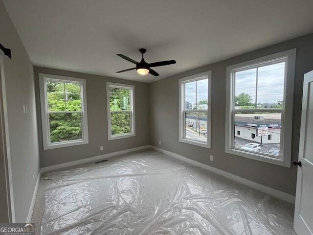 968 Bibbs Cir NW, Atlanta, GA 30318 - unfurnished room with baseboards and a ceiling fan