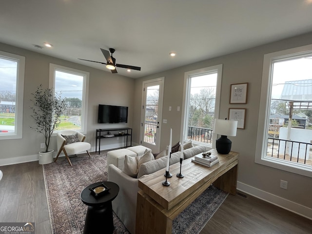 968 Bibbs Cir NW, Atlanta, GA 30318 - living room featuring dark wood-style floors, visible vents, ceiling fan, and a healthy amount of sunlight