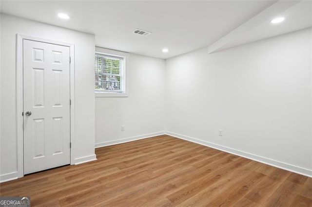 interior space featuring recessed lighting, visible vents, wood finished floors, and baseboards