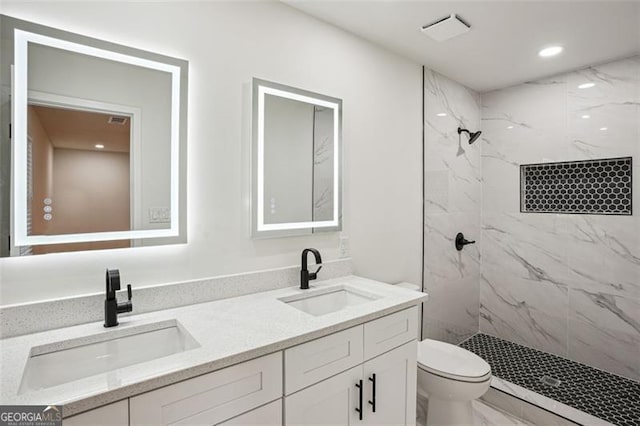 full bathroom featuring a marble finish shower, marble finish floor, and a sink