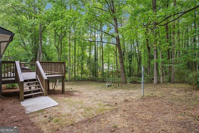 view of yard featuring stairway and a deck