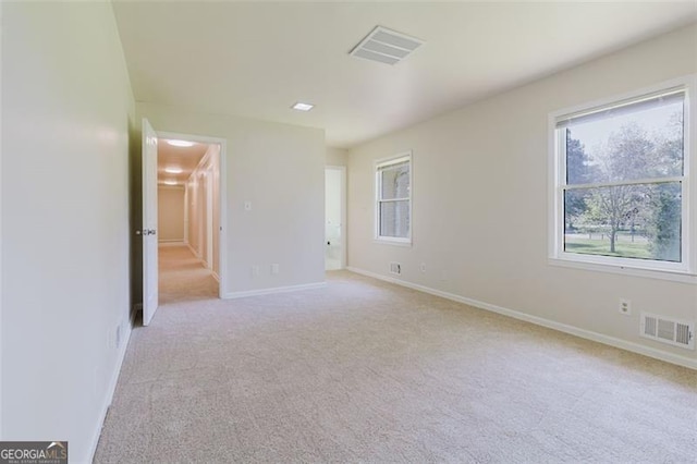 11433 Panhandle Rd, Hampton, GA 30228 - unfurnished room featuring visible vents, baseboards, and light carpet