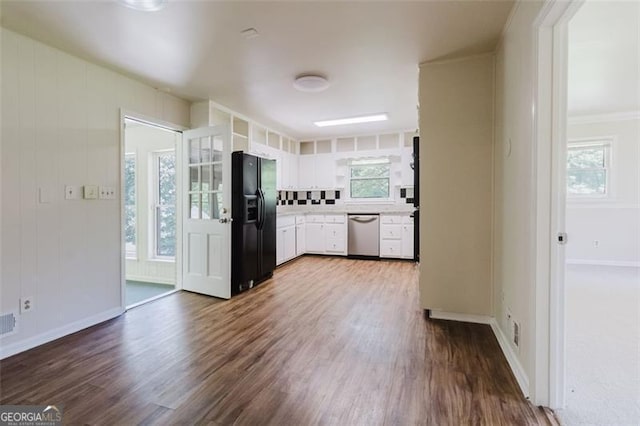 11433 Panhandle Rd, Hampton, GA 30228 - kitchen with white cabinets, light countertops, black refrigerator with ice dispenser, dishwasher, and dark wood-type flooring