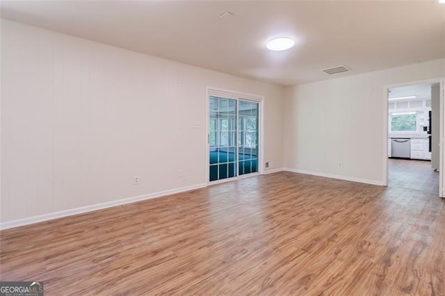 11433 Panhandle Rd, Hampton, GA 30228 - unfurnished room featuring visible vents, light wood-style flooring, and baseboards
