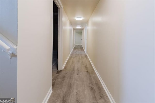 11433 Panhandle Rd, Hampton, GA 30228 - corridor featuring wood finished floors and baseboards