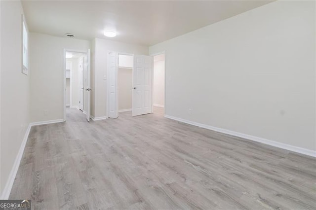 11433 Panhandle Rd, Hampton, GA 30228 - unfurnished bedroom with wood finished floors and baseboards