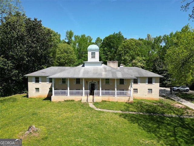 11433 Panhandle Rd, Hampton, GA 30228 - view of front facade featuring a porch, a front lawn, and a chimney
