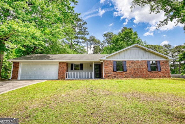 2931 Randolph Ct NE, Conyers, GA 30012 - ranch-style house with an attached garage, concrete driveway, a front lawn, and brick siding