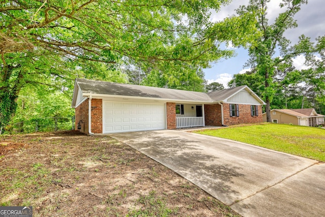 2931 Randolph Ct NE, Conyers, GA 30012 - ranch-style home with brick siding, driveway, fence, and a garage