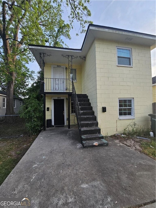 view of front of house with stairs
