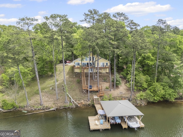 43 Cowan Ct, Mansfield, GA 30055 - dock featuring stairs, boat lift, and a deck with water view
