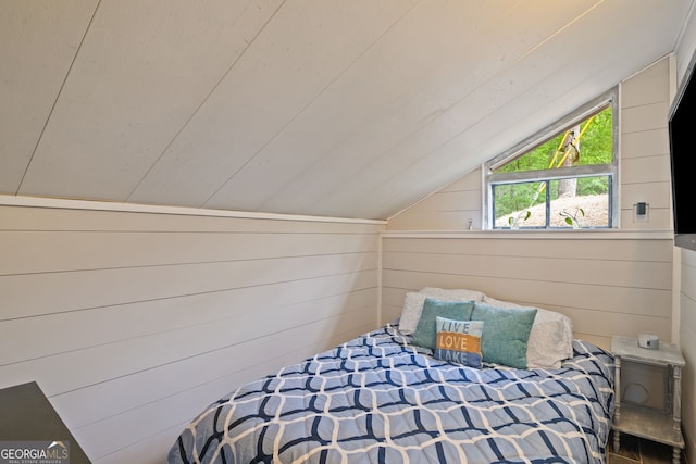 43 Cowan Ct, Mansfield, GA 30055 - bedroom featuring vaulted ceiling and wood walls