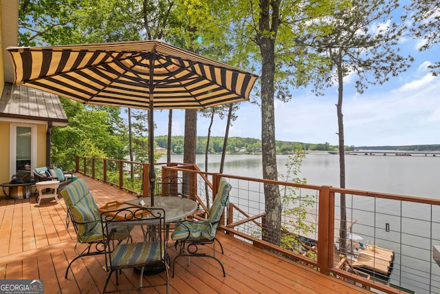 43 Cowan Ct, Mansfield, GA 30055 - wooden deck featuring a water view and outdoor dining area