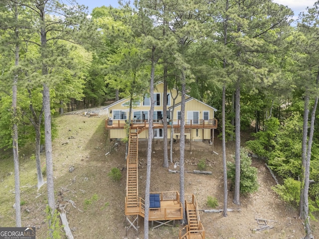 43 Cowan Ct, Mansfield, GA 30055 - rear view of house with stairs and a deck