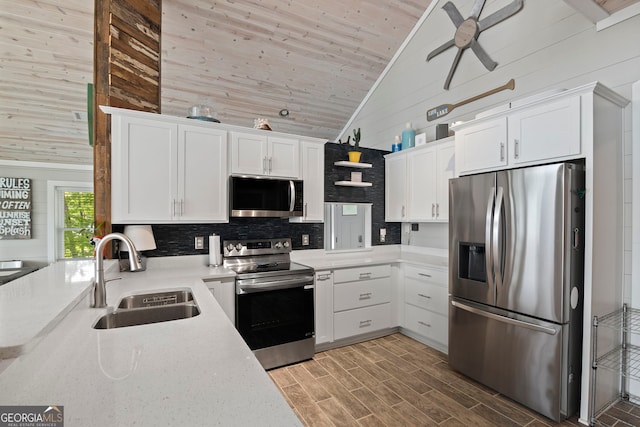 43 Cowan Ct, Mansfield, GA 30055 - kitchen featuring stainless steel appliances, a sink, tasteful backsplash, high vaulted ceiling, and light countertops