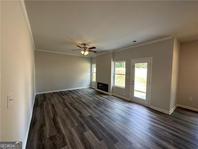 unfurnished living room featuring ceiling fan, visible vents, a fireplace, baseboards, and dark wood-type flooring