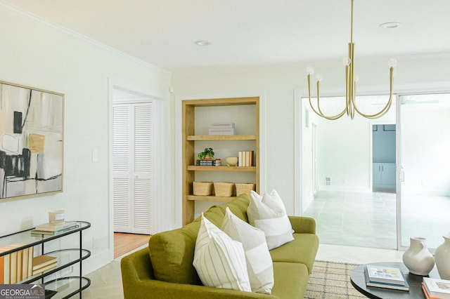 living area featuring crown molding and a chandelier