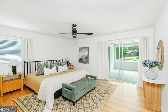 bedroom featuring access to outside, ceiling fan, and light wood-style floors