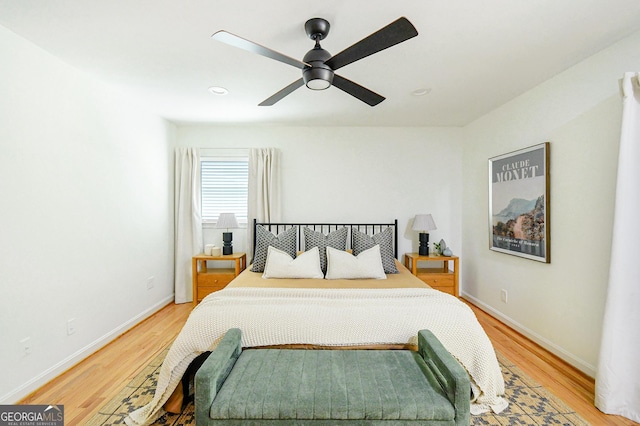 bedroom featuring baseboards, a ceiling fan, recessed lighting, and light wood-style flooring