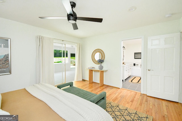 bedroom with a ceiling fan, access to exterior, and wood finished floors